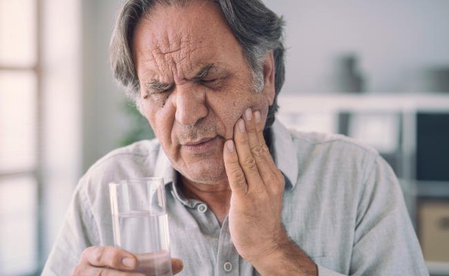 Man in pain caused by dental emergency